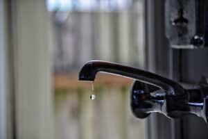 Close up shot black shower faucet before repair