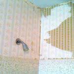 Bathroom with peeling wallpaper before repair