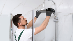tradie worker fixing leaky shower faucet