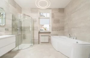 Close-up of a modern shower with clean glass panels and tiles, representing proper shower maintenance in Australia.