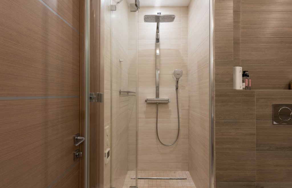 Modern tiled shower with glass screen